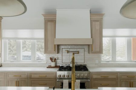 brass hardware with two toned hood white oak kitchen by Crosby Fine Cabinetry Belle Plaine MN