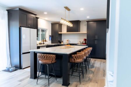 Custom black kitchen with large quartz island in Carver, Minnesota by Crosby Fine Cabinetry Belle Plaine MN