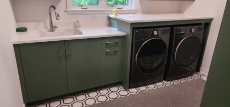 painted green built in washer dryer cabinetry by Crosby Fine Cabinetry Belle Plaine MN