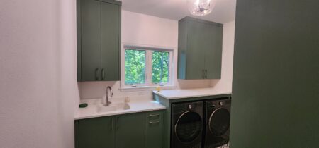 painted green built in cabinets in laundry by Crosby Fine Cabinetry Belle Plaine MN