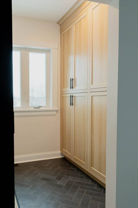 white oak large floor to ceiling pantry cabinets by Crosby Fine Cabinetry Belle Plaine MN