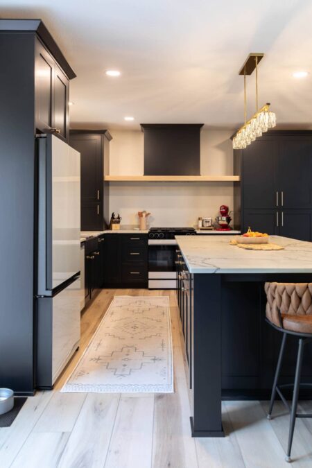 White quartz countertops contrasting with black cabinets by Crosby Fine Cabinetry Belle Plaine MN