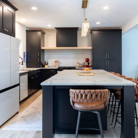 Custom black kitchen with large quartz island in Carver, Minnesota by Crosby Fine Cabinetry Belle Plaine MN