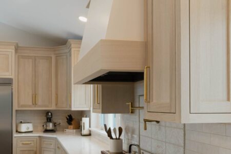 grain matched two toned hood with white painted upper and white oak accent by Crosby Fine Cabinetry Belle Plaine MN