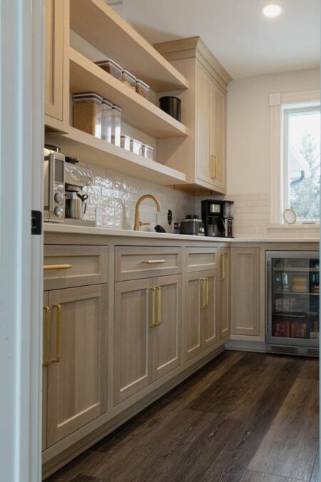 rift white oak pantry cabinets with floating shelves by Crosby Fine Cabinetry Belle Plaine MN